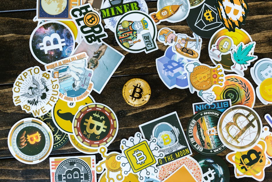 A collection of vibrant Bitcoin-themed stickers and a coin on a wooden surface. Ideal for cryptocurrency concepts.