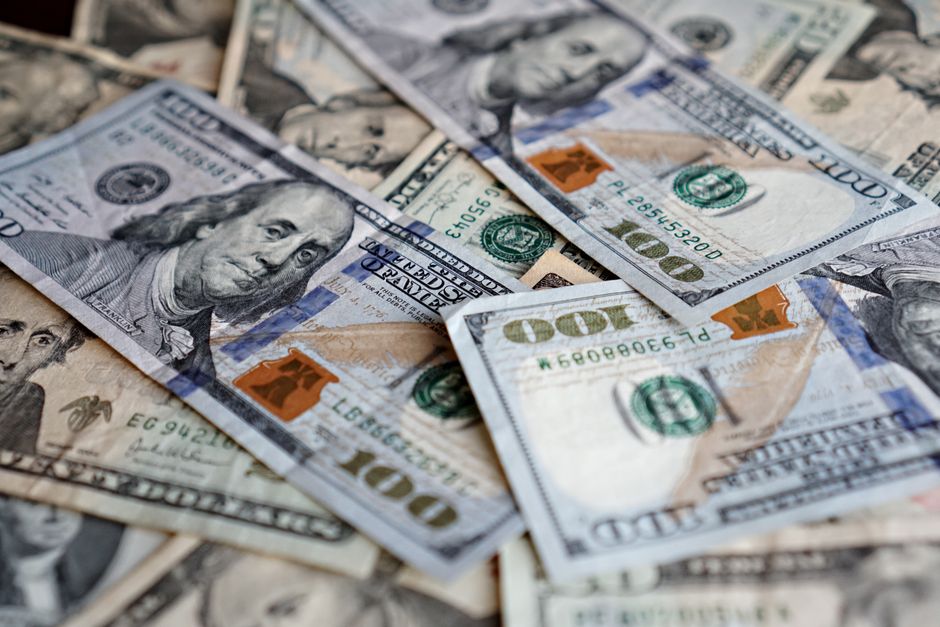 A collection of US dollar bills featuring different denominations, ideal for finance themes.