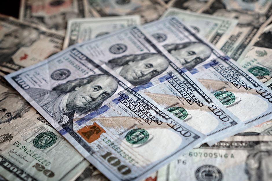 Close-up of various US dollar bills highlighting finance and economy.