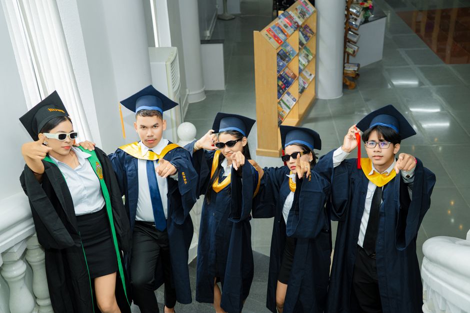 Group of students celebrating graduation at a university in Battambang, Cambodia.